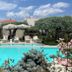 Thassos Olivia Resort in Potos: outdoor pool with loungers, umbrellas and lush garden surroundings