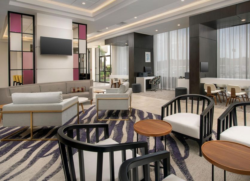 Crowne Plaza San Antonio Airport By IHG lobby seating area with lounge chairs and tables