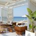 The Danai in Nikiti: beachfront lounge with cabana seating and ocean view