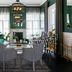 Cape Cadogan Boutique Hotel in Cape Town lounge with patterned chairs, green sofa and a fireplace