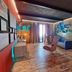 Ocean Suites Santa Maria lounge with modern seating, neon wall art and colorful decor