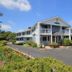 Village Green Motel in South Yarmouth with exterior, parking lot, and balconies