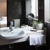 Hotel Rio Bidasoa in Hondarribia bathroom with sink, mirror, window, and bathtub
