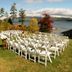 The Lodges at Cresthaven in Lake George: lakeside wedding setup with white chairs overlooking the water