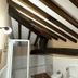 Hotel Palacio La Casona de Cerrazo in Cerrazo bathroom with exposed wooden ceiling beams and glass shower