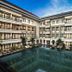 Grand Kuta Hotel and Residence in Kuta with a large courtyard pool and surrounding balconies