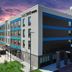 Home2 Suites by Hilton Pensacola I-10 Pine Forest Road exterior with modern facade and covered entrance