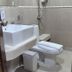 Patong Max Value Hotel bathroom with bathtub, toilet, shower and sink in Patong