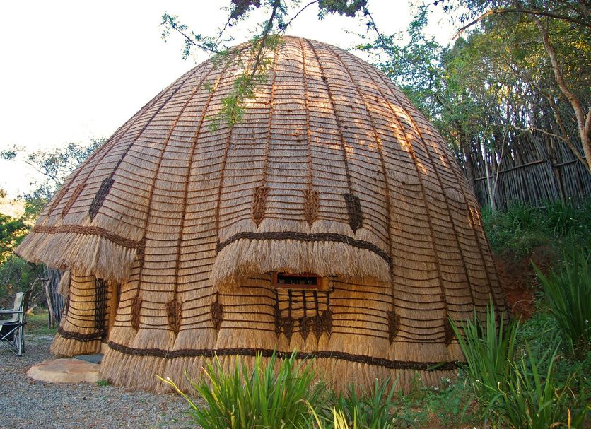 Phophonyane Falls Ecolodge in Piggs Peak: a thatched dome-style lodge surrounded by greenery