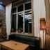 Balvanyos Resort in Baile Balvanyos with stone fireplace, leather seating and large window