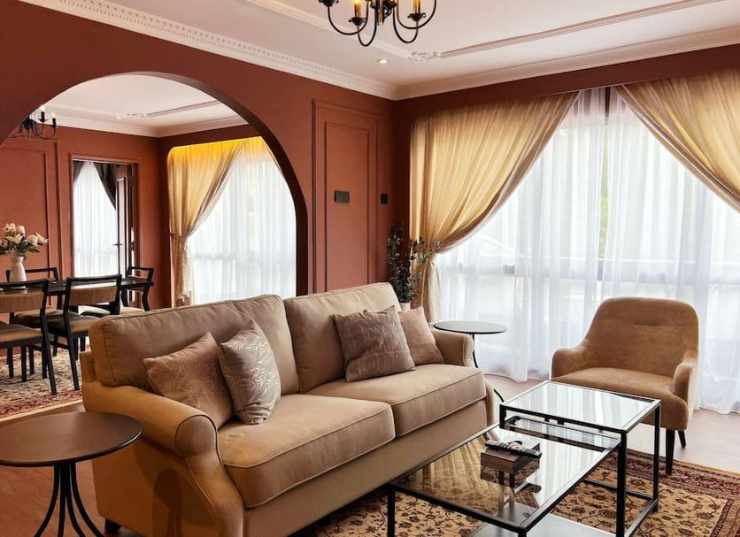Wyndham Garden Shahzan Fraser's Hill living room with sofa, armchair and large windows in Frasers Hill