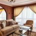 Wyndham Garden Shahzan Fraser's Hill living room with sofa, armchair and large windows in Frasers Hill