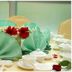 Oriental Crystal Hotel in Kajang banquet table with mint green napkins, white tableware and red flowers