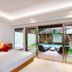Downtown Villas Kuta room with sliding glass doors to private pool deck and garden
