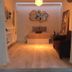 Radio Tulum in Tulum, modern guest room with bed, lounge chair and decorative wall art