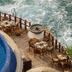 Cala de Mar Resort & Spa Ixtapa terrace dining beside a pool overlooking the ocean waves