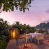 Conrad Bora Bora Nui in Vaitape: seaside terrace dining with sunset views over the lagoon and island