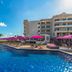 Planet Hollywood Adult Scene Cancun, Cancún: resort pool with pink umbrellas and oceanfront loungers