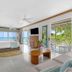Couples Negril in Negril with ocean-view bedroom, balcony doors, and tropical outdoor seating