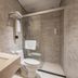 24k International Hotel People's Square in Shanghai bathroom with walk-in shower, toilet and wall-mounted sink