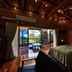 Nagahama Beach Resort Kanon room in Nakijin with wood interior and ocean-view balcony