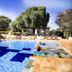 Hotel Fazenda Areia que Canta in Brotas with outdoor swimming pool and lounge chairs
