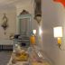 Hotel De La Paix Interlaken dining room with chandelier, table settings, buffet counter and blue curtains