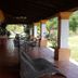 Hotel Villa Cantabria in Mascota with a covered terrace, outdoor seating, and garden views
