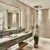 Grace La Margna St Moritz bathroom with double vanity, mirror, soaking tub and walk-in shower