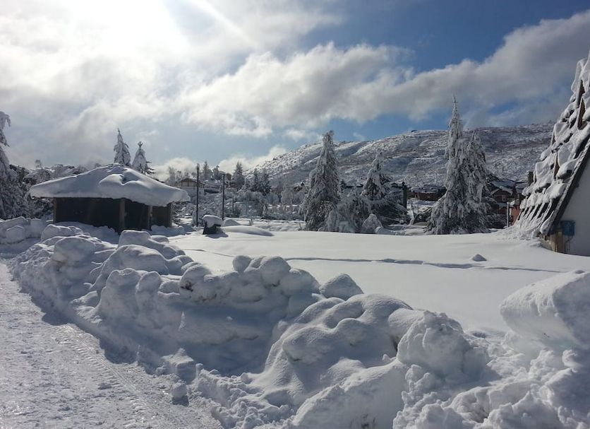 Village Catedral Hotel & Spa in San Carlos de Bariloche, snow-covered alpine landscape with mountains and trees