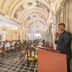 Hotel Ambica Empire Chennai ornate banquet hall with chandeliers, arched ceiling and set dining tables