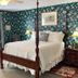 Terrell House B&B in Burnsville bedroom with four-poster bed, floral wallpaper, dresser, and window