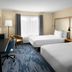 Fairfield Inn & Suites by Marriott Denver Airport guest room with two beds, desk and window