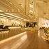 Ashland Hills Hotel & Suites in Ashland lobby with high ceilings, wood floors, and lounge seating