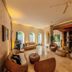 Hotel Boutique Bovedas de Santa Clara By Accor in Cartagena lobby with woven lounge chairs and arched windows