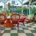 Hale Kawehi Bnb Guesthouse in Hilo with a covered patio dining area and wicker chairs