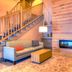 Country Inn & Suites by Radisson, Crystal Lake, IL lobby with staircase, fireplace, and seating area