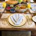 Gatekeeper's Retreat, Niagara-on-the-Lake: elegant breakfast table with orange juice, pastries, fruit, and flowers