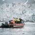Svalbard Hotell | The Vault in Longyearbyen, boat on icy water near a glacier