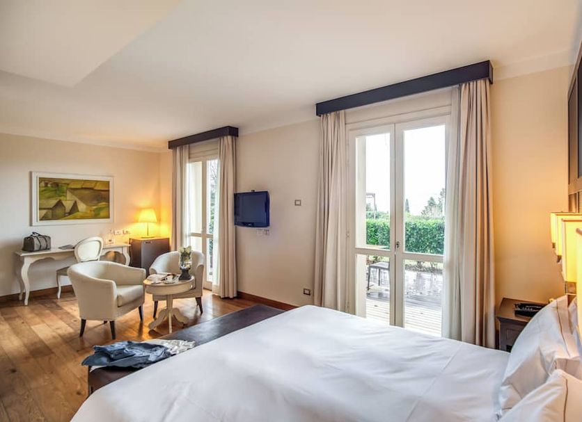Villa Giorgia Albergo in Collina room with balcony doors and seating area in Pistoia