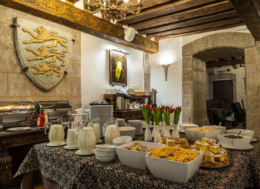 Three Crowns Residents Tallinn breakfast buffet in stone-vaulted dining room