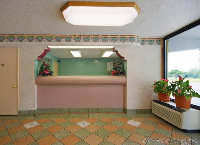 Super Inn in Tillmans Corner lobby front desk with patterned tile floor and window seating