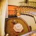 Heritage By Serendib in Blantyre, spiral staircase overlooking a flower-petal atrium