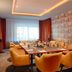 Meeting room at Nyx Hotel Mannheim by Leonardo Hotels in Mannheim with U-shaped table and mustard chairs