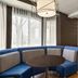 Courtyard by Marriott San Jose South/Morgan Hill lobby seating area with blue curved banquette and table