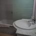 Águilas de los Collados bathroom with bathtub, sink, and frosted glass shower screen in Águilas
