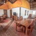 Bamboo Bungalow Resthouse Boracay dining area with wooden tables and vaulted bamboo ceiling in Boracay