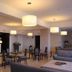 Miramare Scilla Gyh Luxury lobby with lounge seating, tables, pendant lights and floral arrangement in Scilla