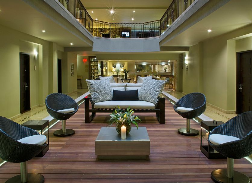 Movich Casa del Alferez in Cali lobby with modern seating and a two-level atrium