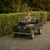 The Gleneagles Hotel, Auchterarder: child riding in a small vintage-style utility car on a garden path
